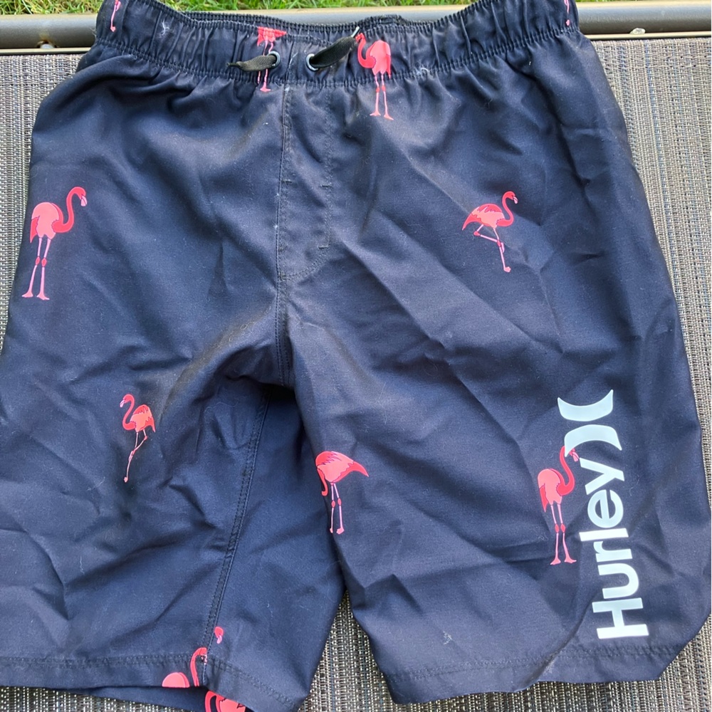 Hurley boys swim trunk size med 10/12. Black with pink flamingos Brand New w/tag